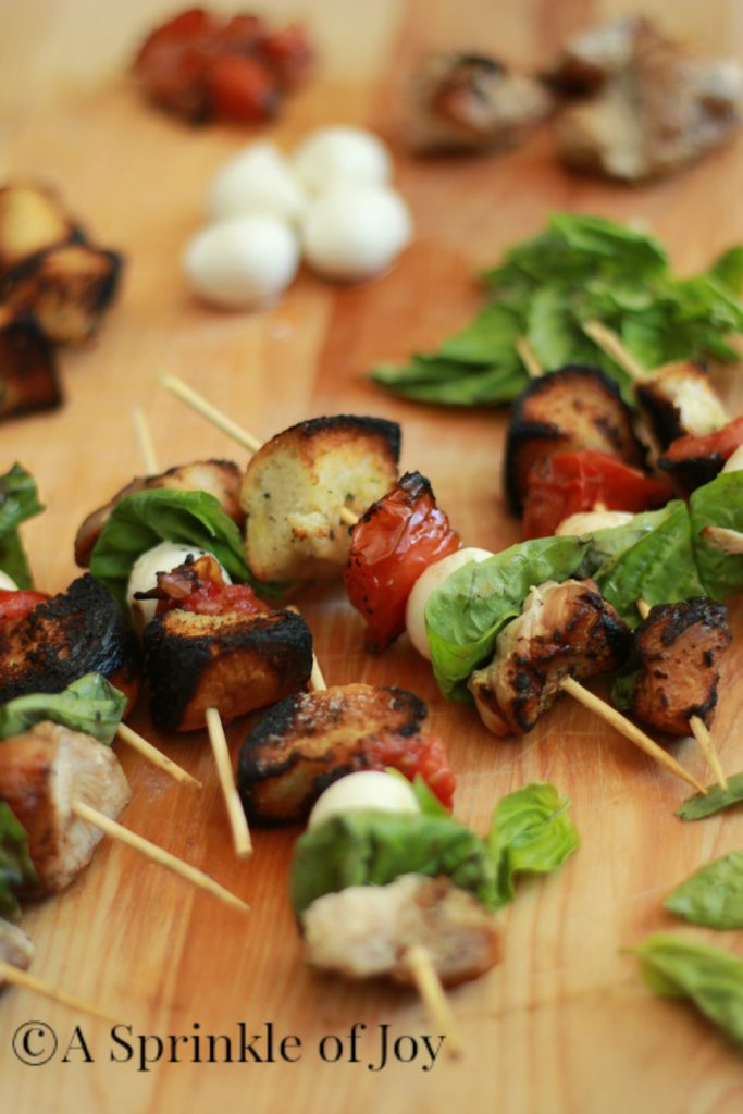 These quick and simple grilled chicken caprese kabobs are sure to be a hit at any BBQ. Grilled chicken, fresh mozzarella, basil, tomatoes and bread. All drizzled with balsamic vinegar.