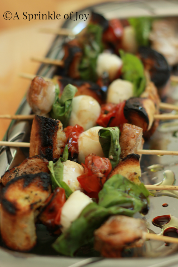 These quick and simple grilled chicken caprese kabobs are sure to be a hit at any BBQ. Grilled chicken, fresh mozzarella, basil, tomatoes and bread. All drizzled with balsamic vinegar.