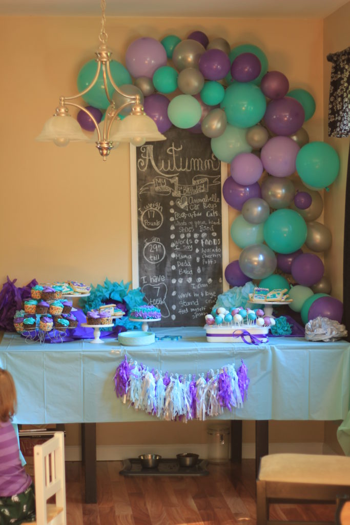 A purple and turquoise first birthday theme, that is easy to do on your own! 