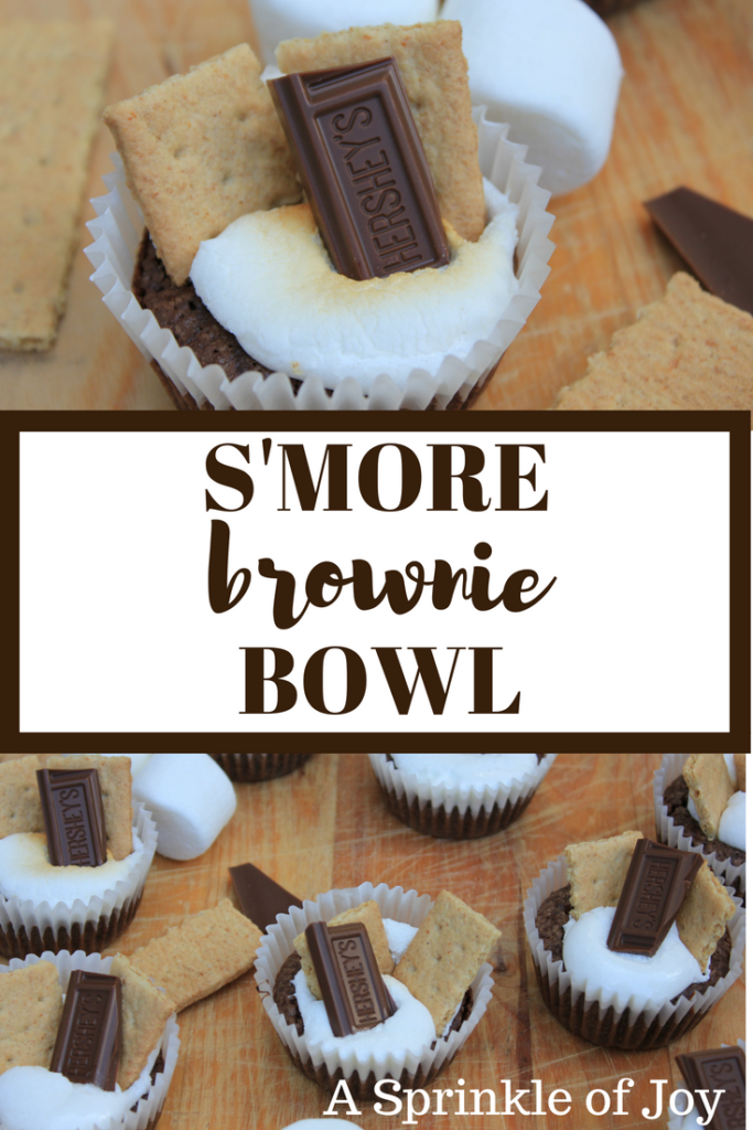 Made with brownie batter, toasted marshmallow, graham crackers and chocolate, this s'more brownie bowl is quick and easy to make. #smore #summer #brownie 