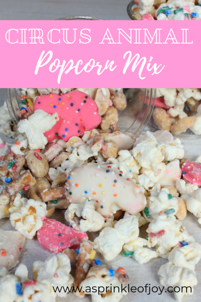 A  simple and tasty treat using chocolate, almond bark, and frosted circus animal cookies. #popcorn #party #snackmix