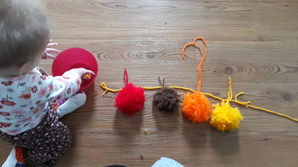 How to make your own easy DIY pom pom garland decoration out of yarn.  Simple and easy to do!