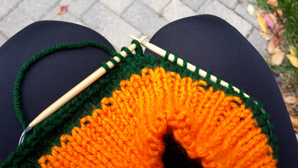 Free pattern for a knitted pumpkin cozy.  Free knitted pumpkin tumbler cozy.  Simple knit pumpkin cozy.