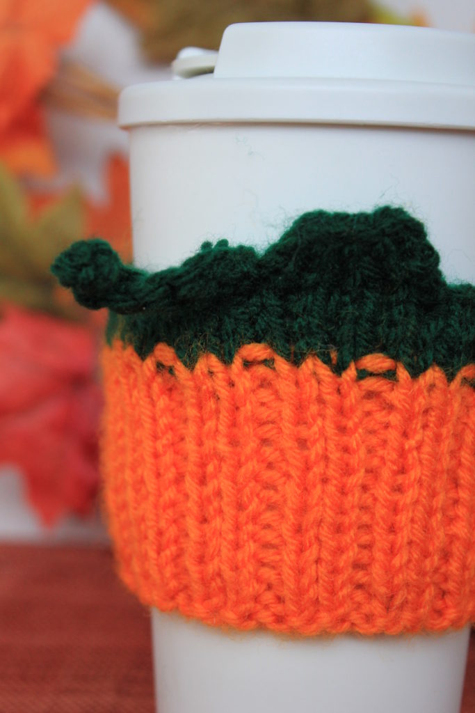 Free pattern for a knitted pumpkin cozy.  Free knitted pumpkin tumbler cozy.  Simple knit pumpkin cozy.