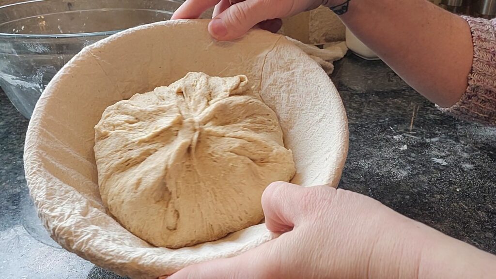 place sourdough discard bread in banneton 