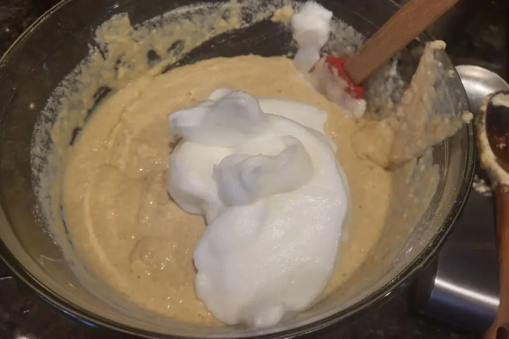 folding in whipped egg whites to fresh milled flour batter
