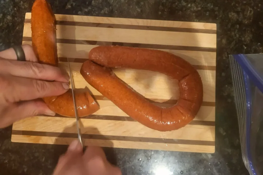 cutting sausage for kabob