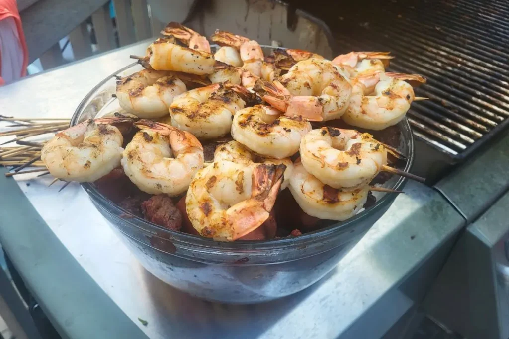 grilled steak and shrimp kabobs in bowl