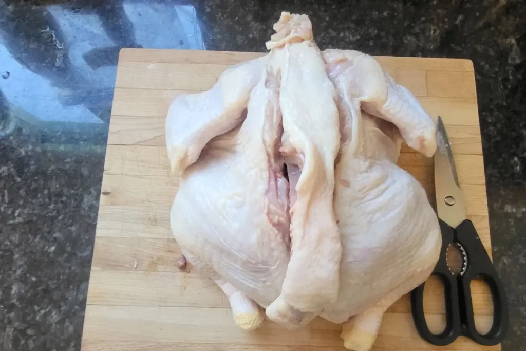 cutting chicken backbone