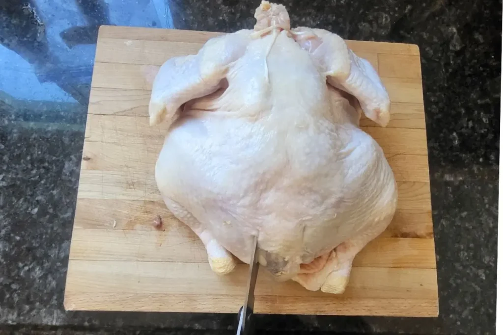 cutting chicken backbone